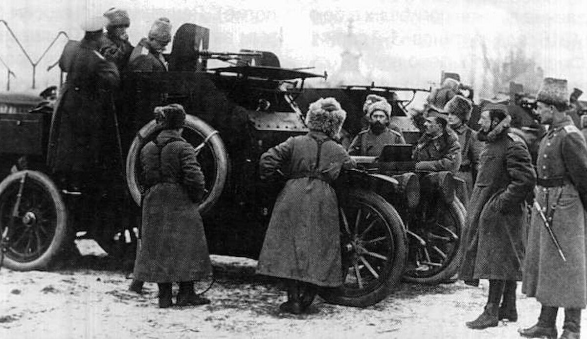 Belgian soldiers showing their Russian comrades one of their armored vehicles