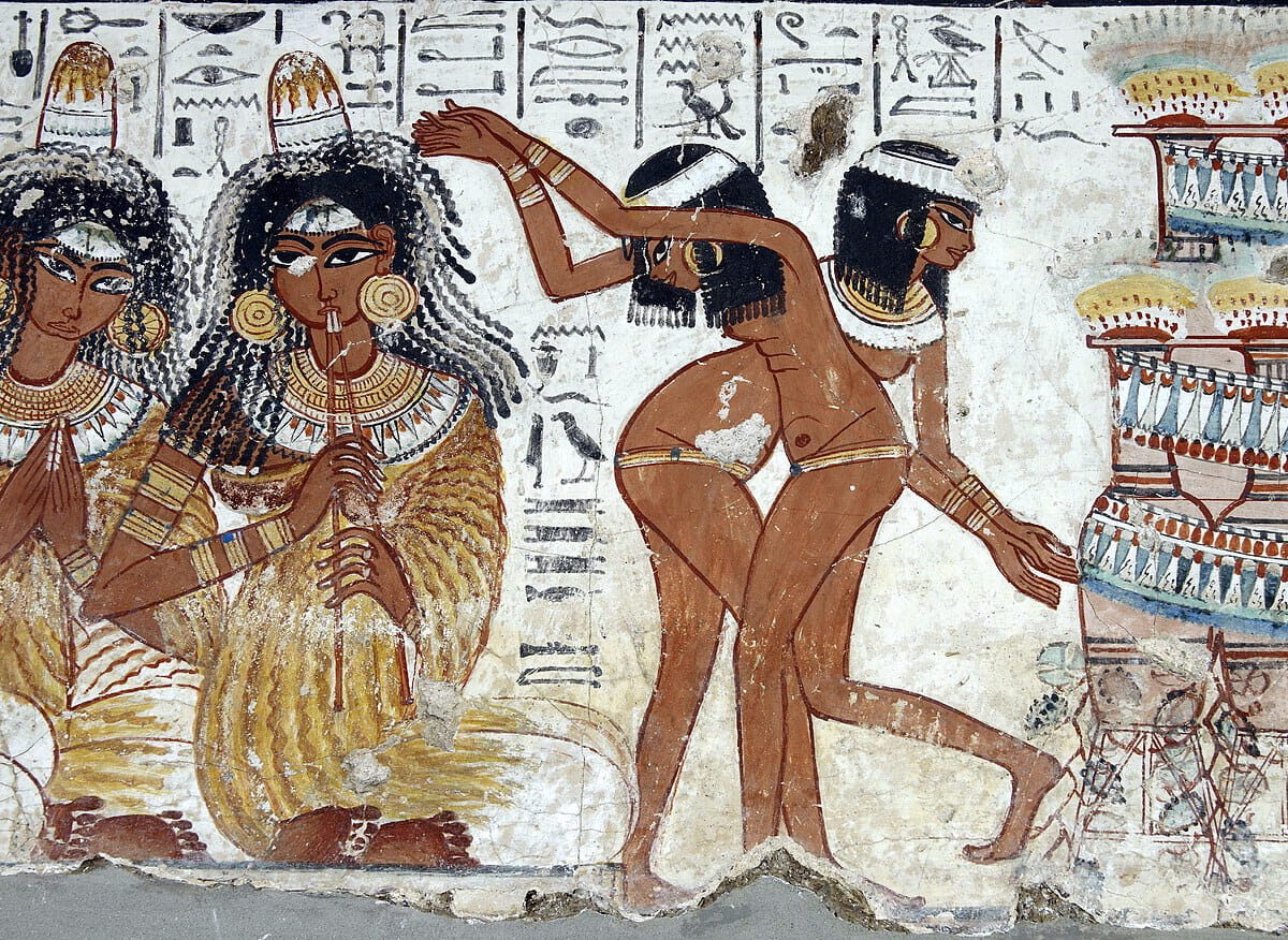 Musicians and dancers in paintings from the tomb of the scribe Nebamun, with cones on the head.