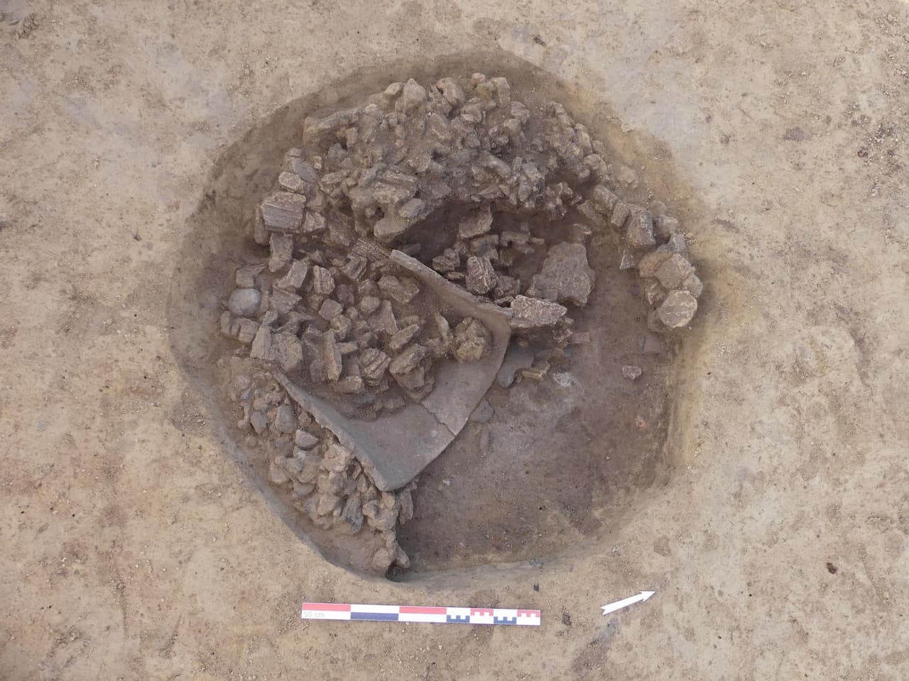 View of the upper levels of a Late Neolithic silo (4000-3400 B.C.), largely filled with burned cob, Pfulgriesheim.